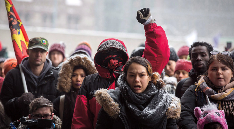 People gather in Nathan Phillips Square in Toronto on Feb. 10, 2018, to protest the verdict in the trial of Gerald Stanley, who was acquitted of murder in the death of Colten Boushie. [icon image] Chris Donovan / Canadian Press