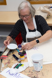 student working on art piece