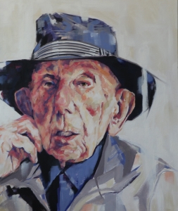 portrait of older man wearing a fedora hat