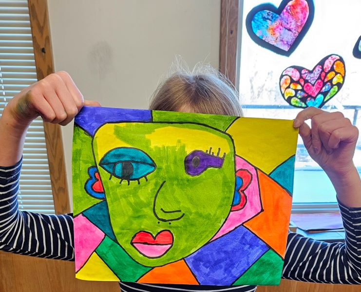 child with picasso style drawing