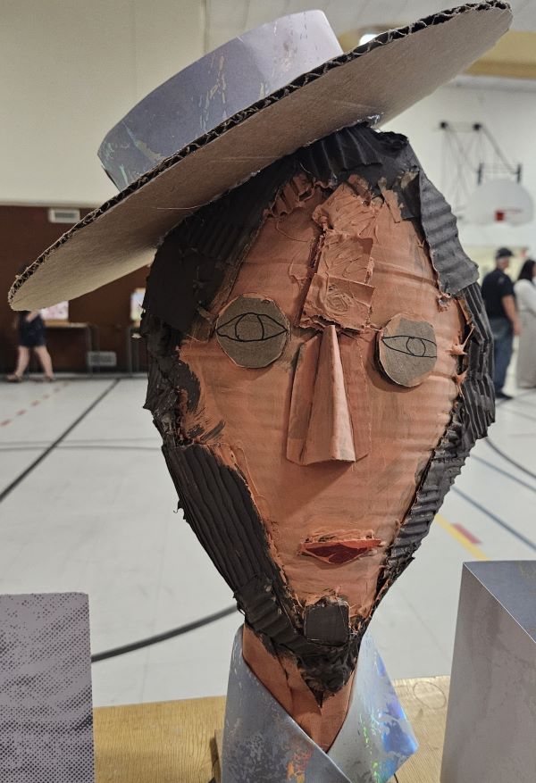 cardboard sculpture of a person's head