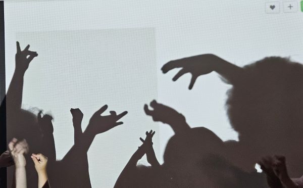 children making hand shadows